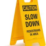 SmartSign - SF-0292-FB-25x12 Caution - Slow Down, Pedestrians In Area Folding Floor Sign By | 25" x 12" Plastic Black on Yellow