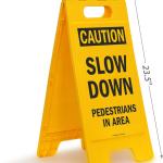 SmartSign - SF-0292-FB-25x12 Caution - Slow Down, Pedestrians In Area Folding Floor Sign By | 25" x 12" Plastic Black on Yellow