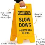 SmartSign - SF-0292-FB-25x12 Caution - Slow Down, Pedestrians In Area Folding Floor Sign By | 25" x 12" Plastic Black on Yellow